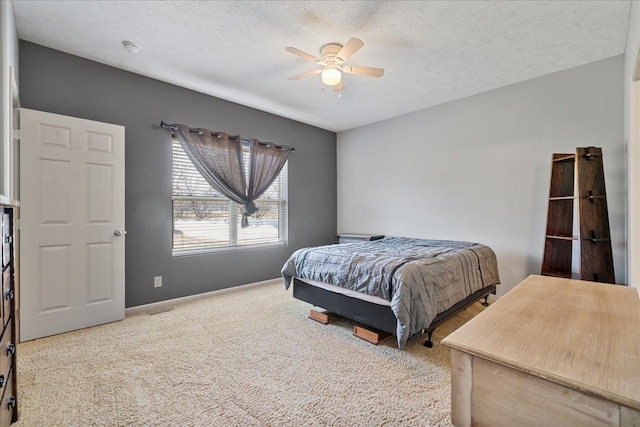 7714 S 167th St, Omaha, NE 68136 - carpeted bedroom with baseboards, a textured ceiling, and ceiling fan