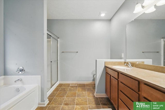 7714 S 167th St, Omaha, NE 68136 - bathroom with vanity, baseboards, a bath, and a stall shower