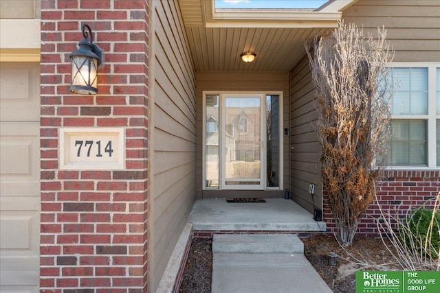 7714 S 167th St, Omaha, NE 68136 - view of exterior entry featuring brick siding