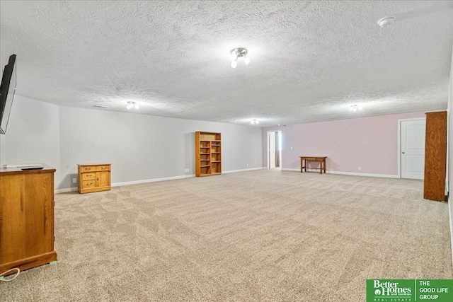 7714 S 167th St, Omaha, NE 68136 - finished basement featuring light colored carpet, a textured ceiling, and baseboards