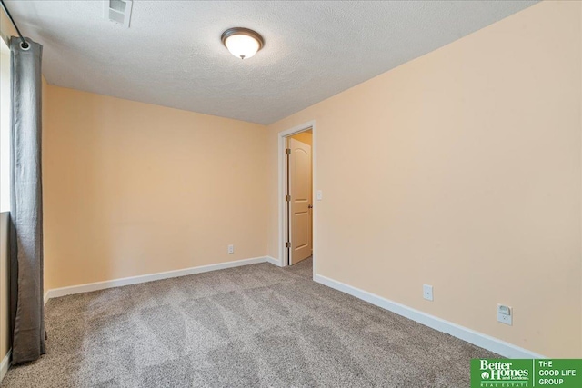 7714 S 167th St, Omaha, NE 68136 - carpeted spare room featuring baseboards, a textured ceiling, and visible vents