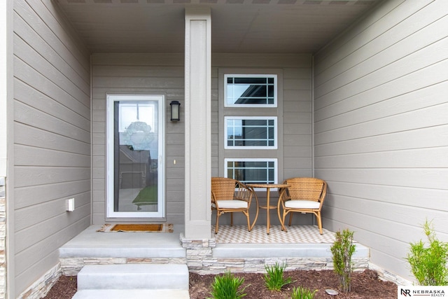 doorway to property with a porch