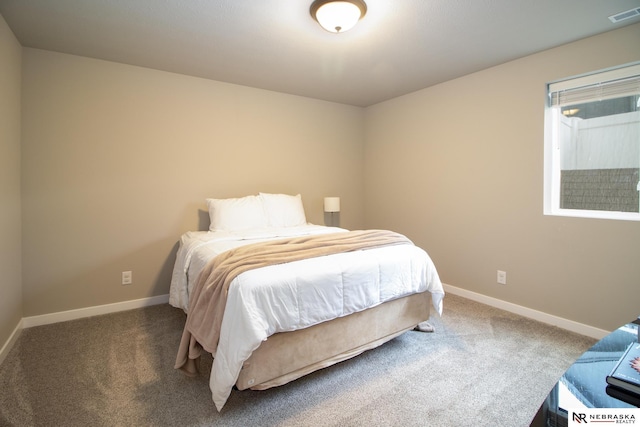 bedroom featuring visible vents, carpet flooring, and baseboards