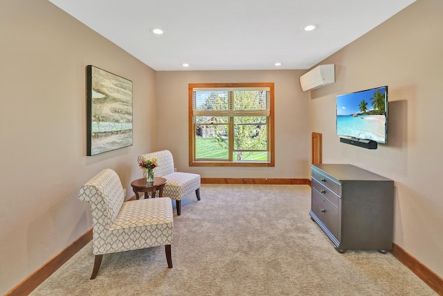 living area with baseboards, an AC wall unit, recessed lighting, and light colored carpet