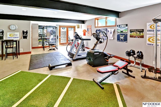 workout room with baseboards