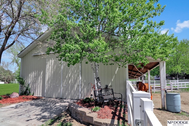 view of side of home with fence