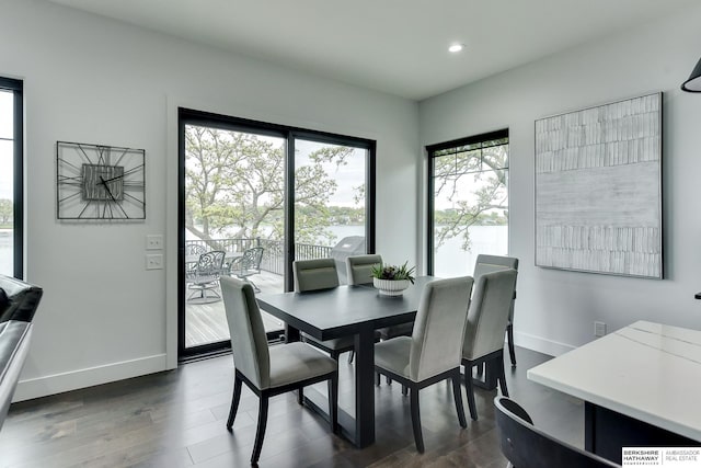 dining space featuring baseboards, recessed lighting, and dark wood-type flooring