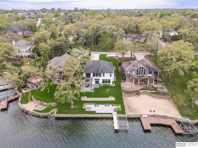 birds eye view of property featuring a water view and a residential view