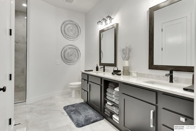 full bathroom with double vanity, marble finish floor, baseboards, a sink, and a tile shower