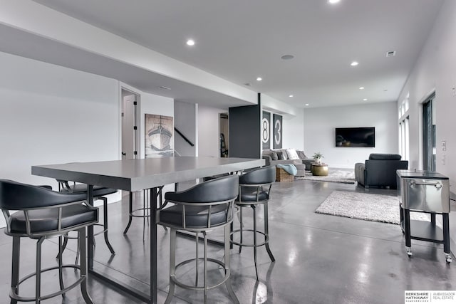 interior space with recessed lighting, concrete flooring, and visible vents