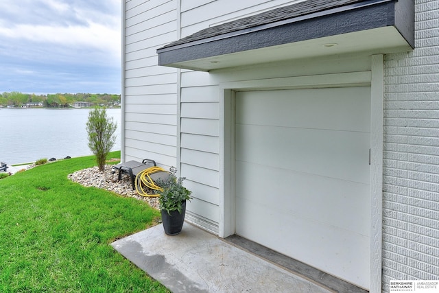 exterior space with a lawn and a water view
