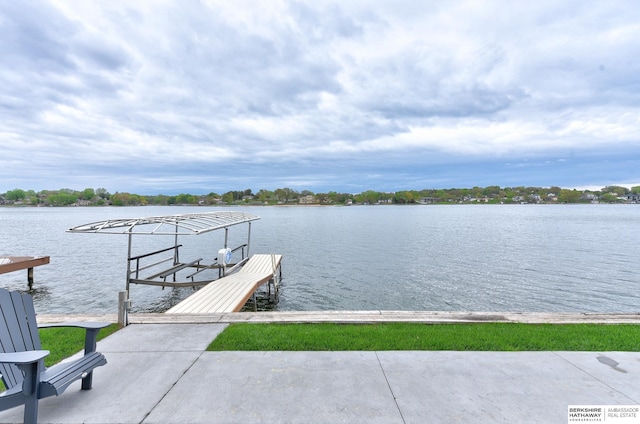 view of dock with boat lift and a water view