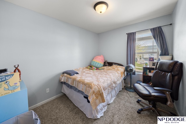 bedroom featuring baseboards and carpet floors
