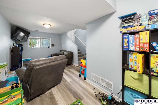 game room with wood finished floors and visible vents