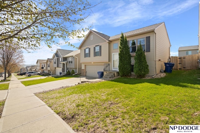 view of front of house with fence, a residential view, a garage, a front yard, and concrete driveway