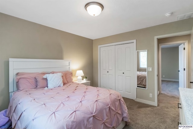 bedroom featuring baseboards, light colored carpet, and a closet