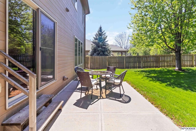 view of patio / terrace featuring fence and outdoor dining space
