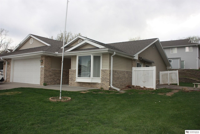 single story home featuring fence, an attached garage, a front yard, and brick siding