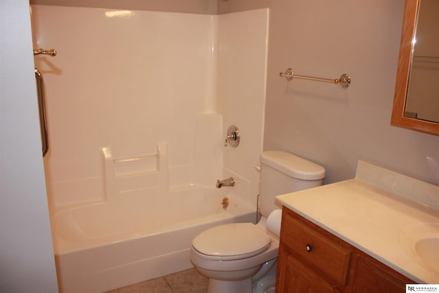 bathroom with vanity, toilet, tile patterned flooring, and bathtub / shower combination