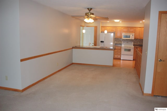kitchen with light colored carpet, white appliances, a ceiling fan, a peninsula, and decorative backsplash