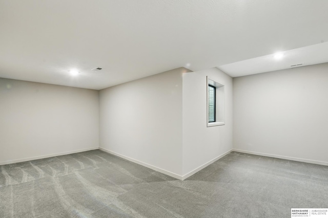 basement featuring carpet flooring, recessed lighting, and baseboards