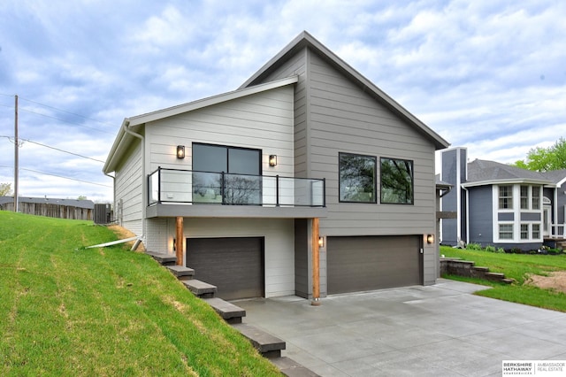 view of front facade featuring an attached garage, a front lawn, a balcony, central air condition unit, and driveway