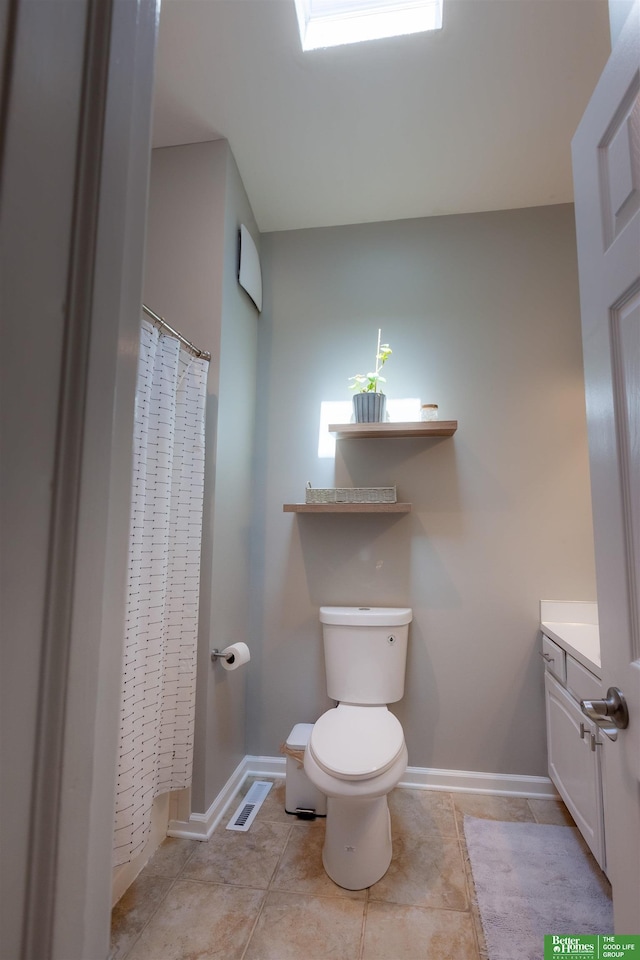 bathroom with baseboards, tile patterned floors, visible vents, and toilet