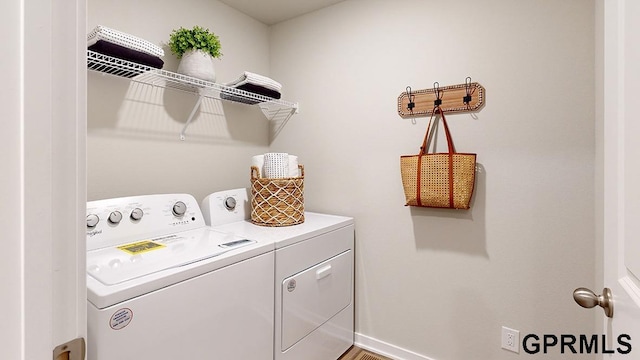 12663 S 205th St, Gretna, NE 68028 - laundry room with baseboards, laundry area, and washing machine and dryer