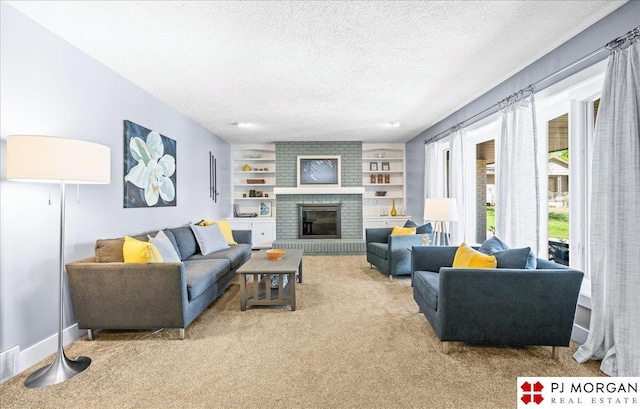 carpeted living room with a fireplace, a textured ceiling, and visible vents