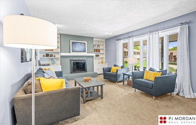 living room with a textured ceiling, built in features, carpet, and a fireplace