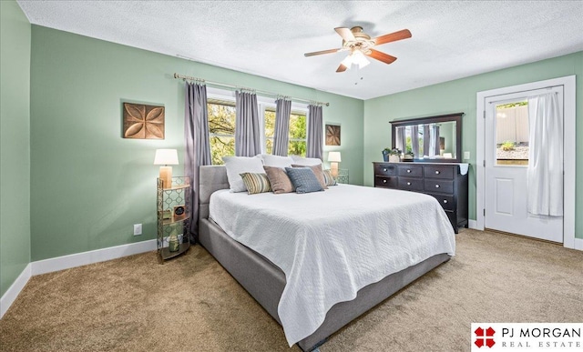 bedroom featuring baseboards, carpet flooring, a textured ceiling, and ceiling fan