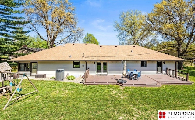 back of property featuring a lawn, central AC unit, a wooden deck, and french doors