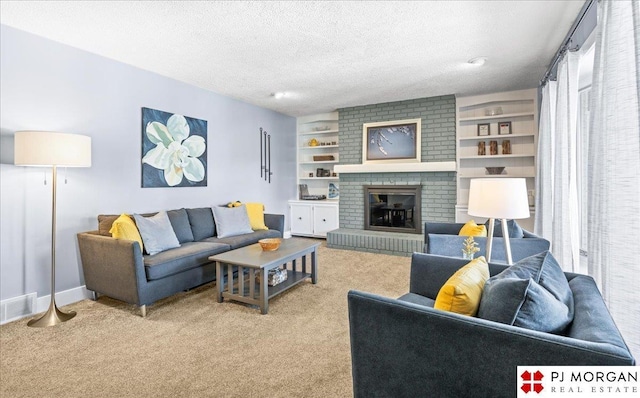 living room featuring light colored carpet, a brick fireplace, a textured ceiling, baseboards, and visible vents
