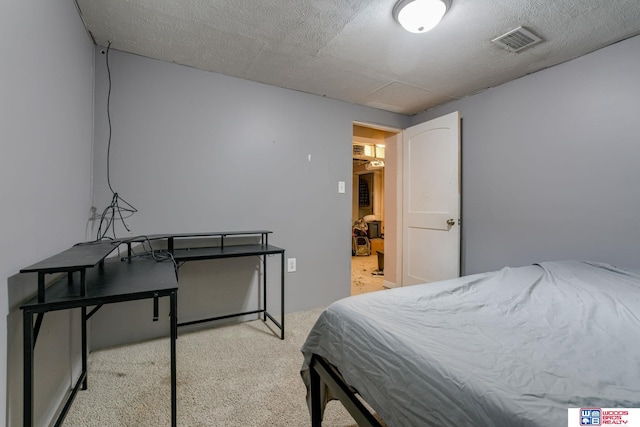 carpeted bedroom with visible vents