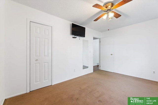 unfurnished bedroom with baseboards and carpet flooring