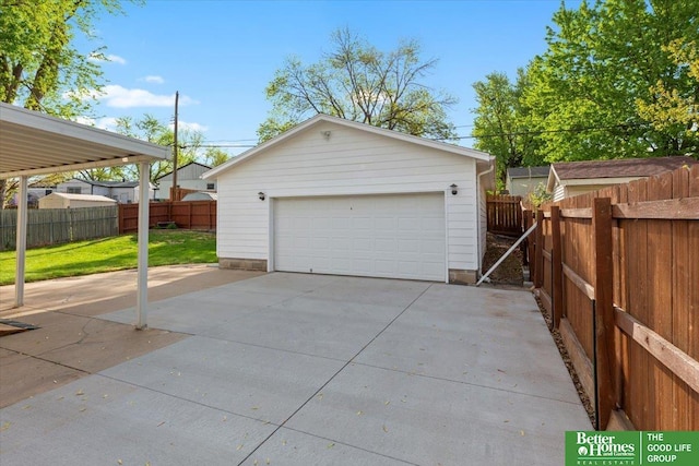 detached garage featuring fence