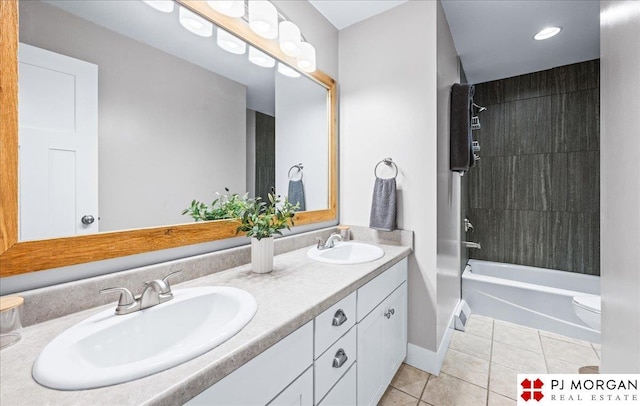 full bathroom featuring a sink, baseboards, tile patterned flooring, and double vanity