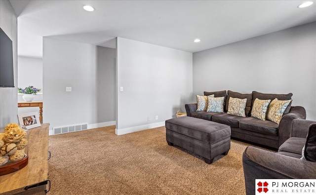 carpeted living area with baseboards, recessed lighting, and visible vents