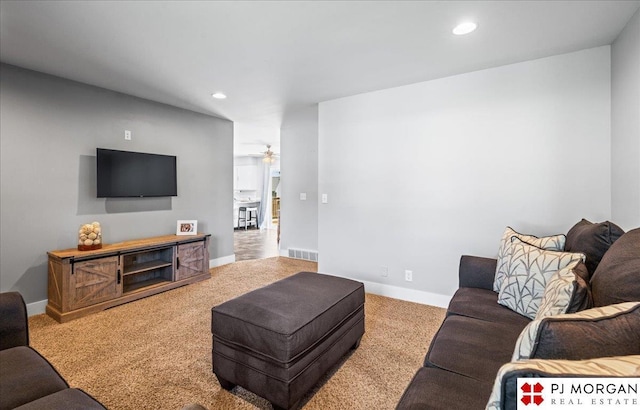 living room featuring carpet floors, a ceiling fan, recessed lighting, and visible vents