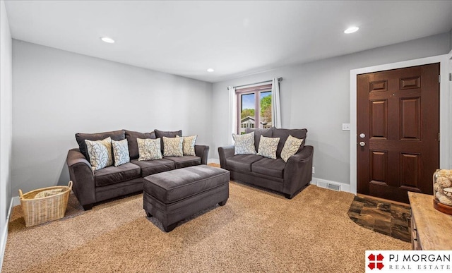 living area featuring carpet floors, recessed lighting, baseboards, and visible vents