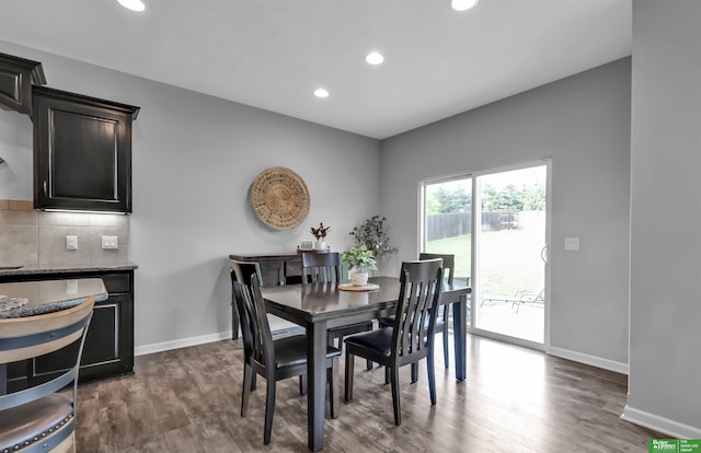 dining area with dark wood-type flooring, recessed lighting, and baseboards