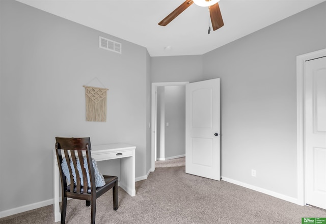 sitting room featuring visible vents, a ceiling fan, baseboards, and light colored carpet