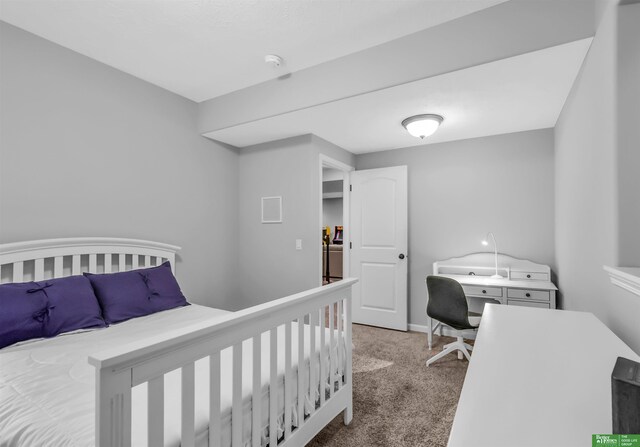 carpeted bedroom featuring baseboards