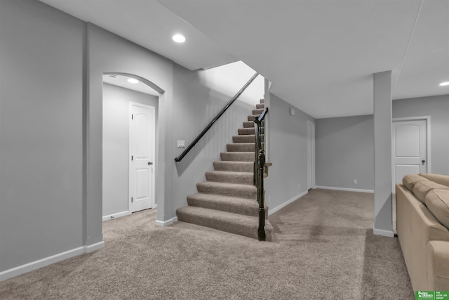 stairs with carpet floors, recessed lighting, and baseboards
