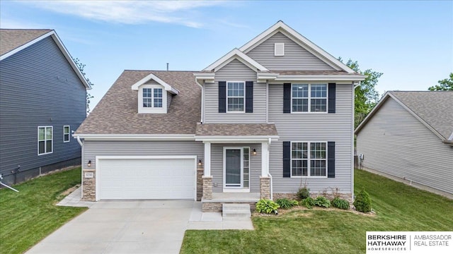 8230 Kilpatrick Pkwy, Bennington, NE 68007 - view of front of property with concrete driveway, a garage, a front lawn, and roof with shingles