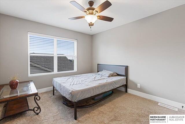 8230 Kilpatrick Pkwy, Bennington, NE 68007 - carpeted bedroom featuring baseboards and a ceiling fan