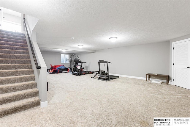 8230 Kilpatrick Pkwy, Bennington, NE 68007 - exercise area with carpet flooring, baseboards, and a textured ceiling