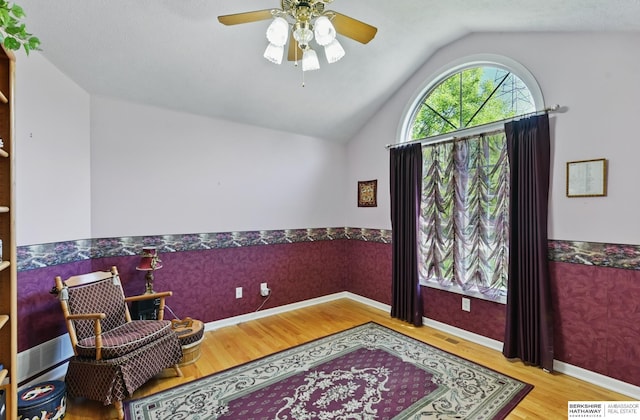 11402 Todd Dr, Blair, NE 68008 - sitting room with wood finished floors, lofted ceiling, and a ceiling fan
