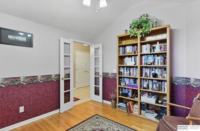 11402 Todd Dr, Blair, NE 68008 - living area featuring french doors, wood finished floors, lofted ceiling, and ceiling fan