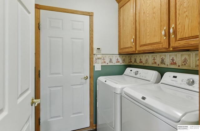 11402 Todd Dr, Blair, NE 68008 - laundry area with washing machine and clothes dryer and cabinet space
